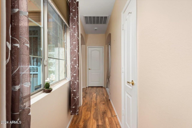 hallway featuring dark hardwood / wood-style floors