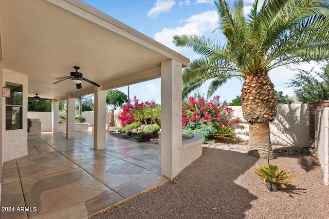 view of patio featuring ceiling fan