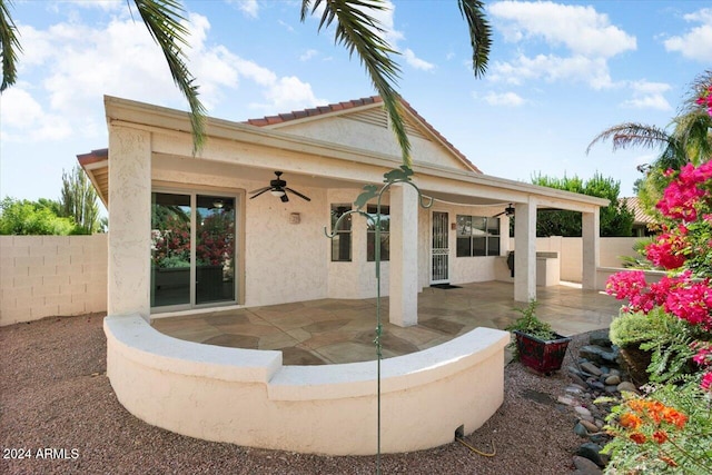 back of property with a patio and ceiling fan