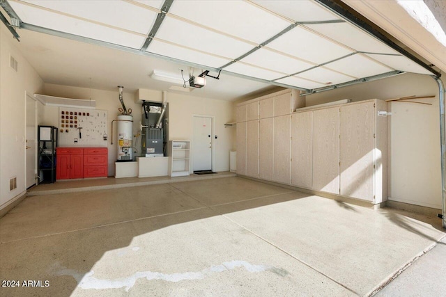 garage with water heater, heating unit, and a garage door opener