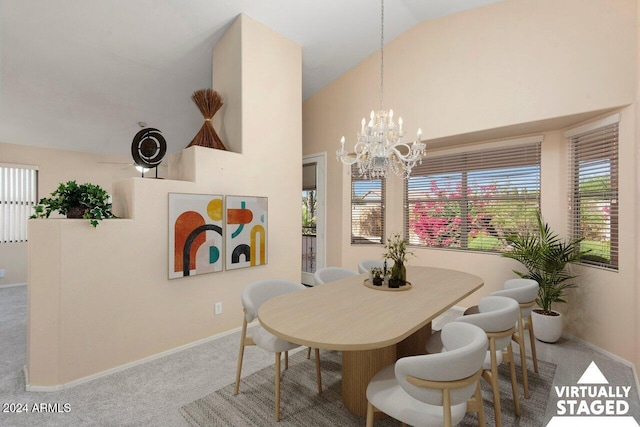 carpeted dining space featuring vaulted ceiling and a notable chandelier