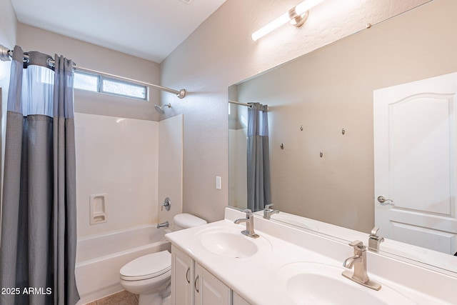 full bathroom featuring double vanity, toilet, shower / bath combo with shower curtain, and a sink