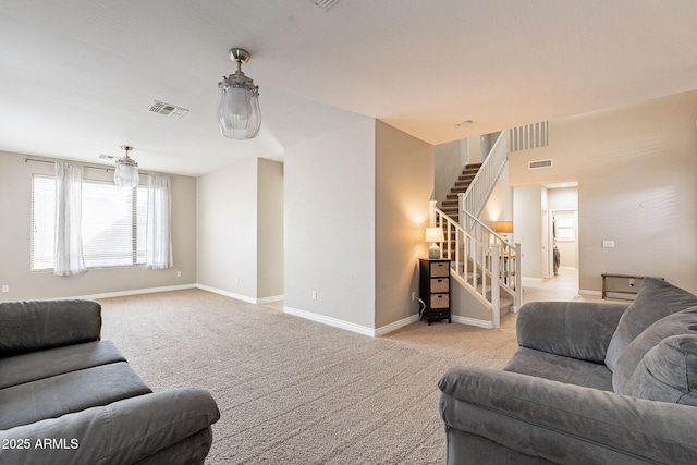 living room featuring stairs, carpet flooring, baseboards, and visible vents