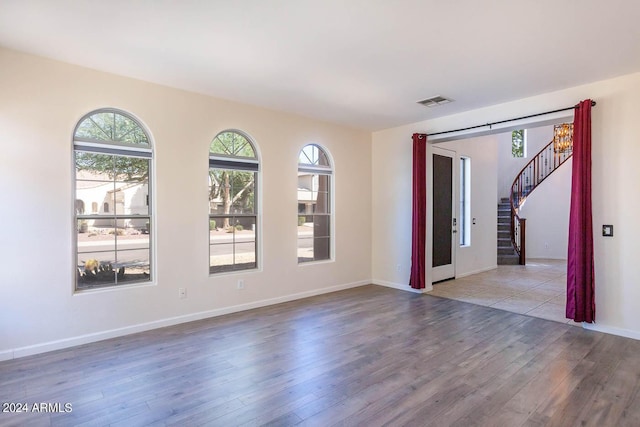 spare room featuring light hardwood / wood-style flooring