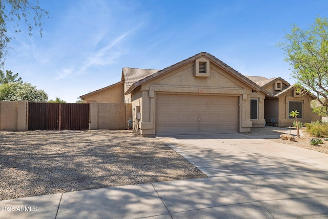 28814 N 45th St, Cave Creek, AZ 85331 - view of front of home with a garage, stucco siding, driveway, and a tiled roof