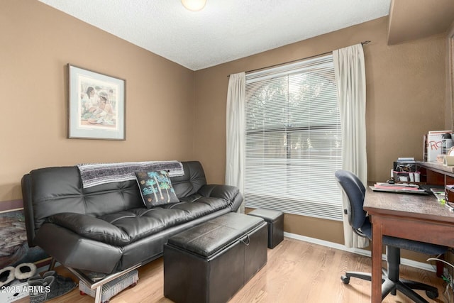 office area with light hardwood / wood-style floors