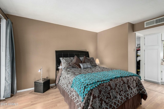 bedroom featuring light hardwood / wood-style flooring