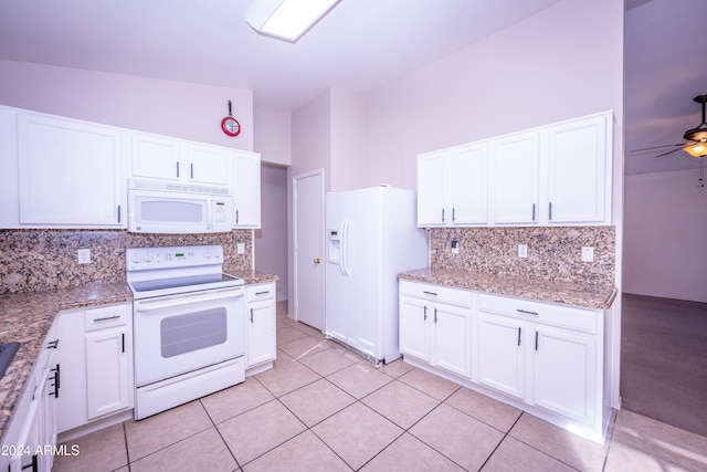 kitchen featuring light stone countertops, white appliances, ceiling fan, light tile patterned floors, and white cabinets