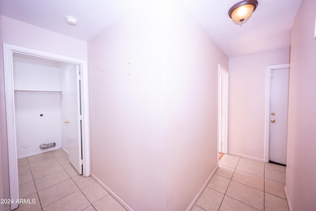 hall with light tile patterned flooring