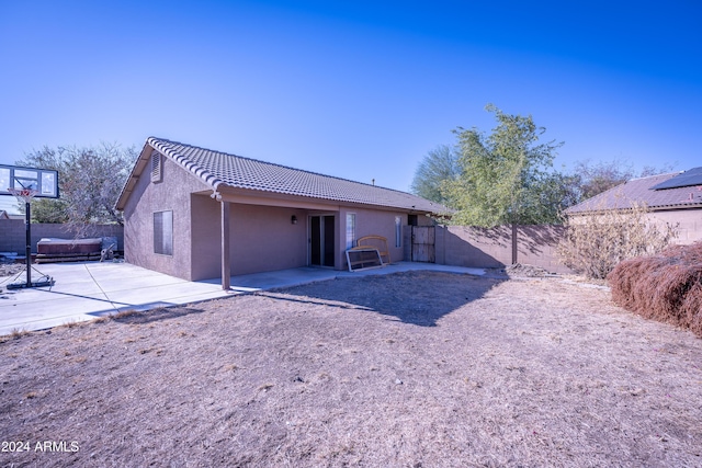 back of house with a patio area