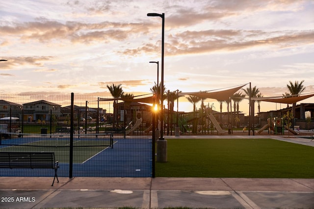 surrounding community with a playground, tennis court, and a lawn