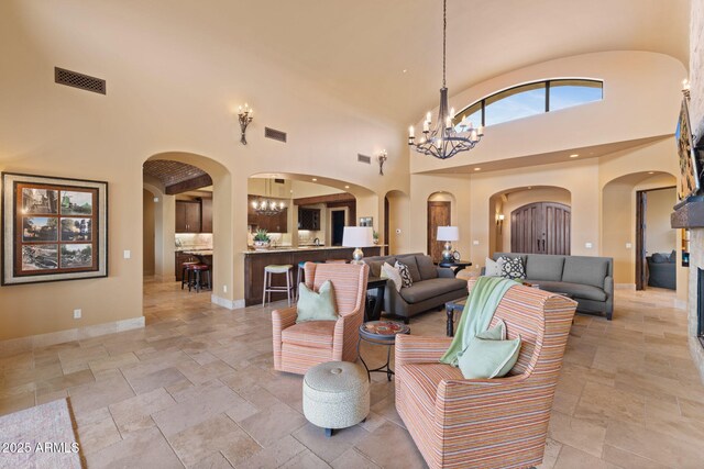 3553 N Crystal Peak Cir, Mesa, AZ 85207 - living area with a high ceiling, stone tile floors, and visible vents