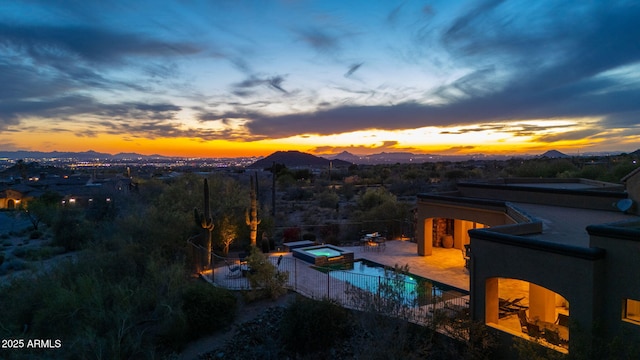 3553 N Crystal Peak Cir, Mesa, AZ 85207 - pool at dusk featuring a patio and a pool with connected hot tub