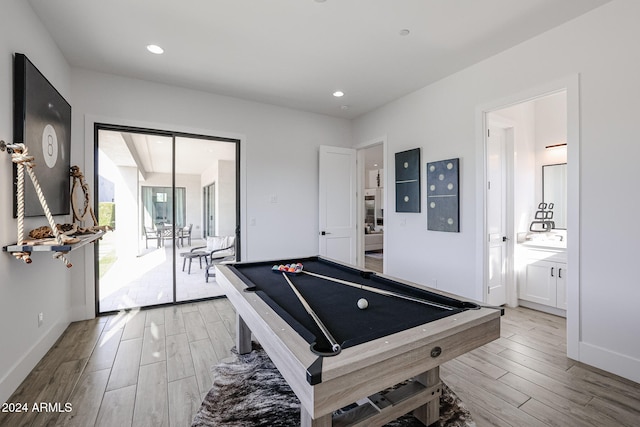 game room with hardwood / wood-style flooring and pool table