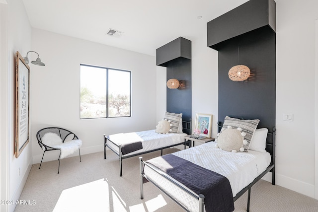 bedroom with light colored carpet