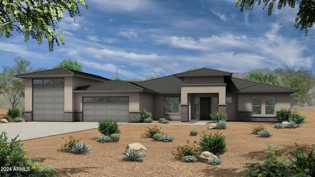 prairie-style house featuring a garage