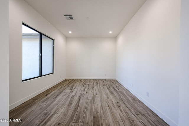 empty room with light hardwood / wood-style floors