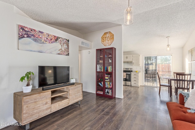 living room featuring a textured ceiling, dark hardwood / wood-style floors, and vaulted ceiling