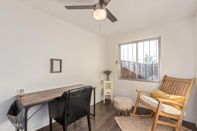 office area featuring dark hardwood / wood-style floors, ceiling fan, and a textured ceiling