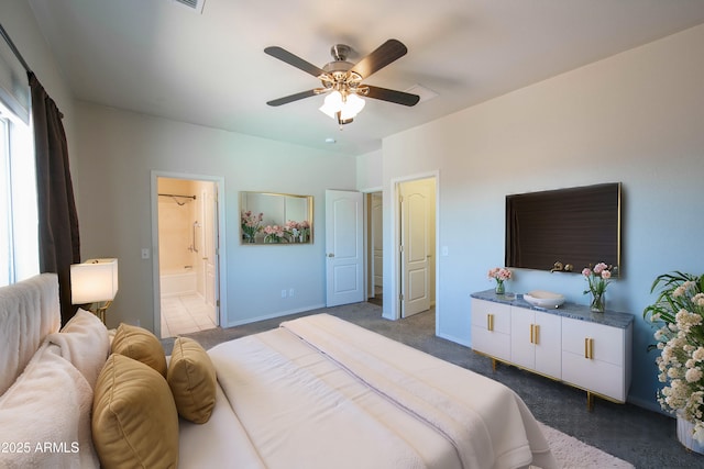 carpeted bedroom featuring ceiling fan, baseboards, and ensuite bathroom