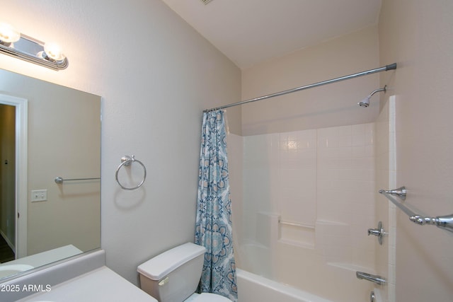 bathroom featuring vanity, shower / bath combo with shower curtain, and toilet