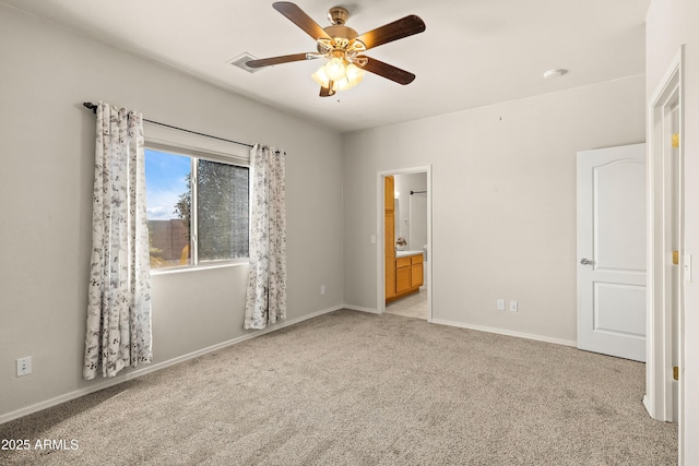 unfurnished bedroom featuring visible vents, light carpet, ceiling fan, ensuite bath, and baseboards