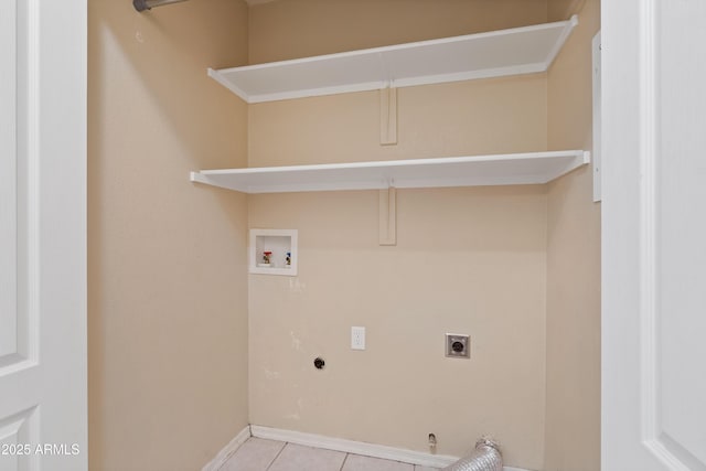 clothes washing area featuring laundry area, hookup for a gas dryer, tile patterned flooring, washer hookup, and electric dryer hookup