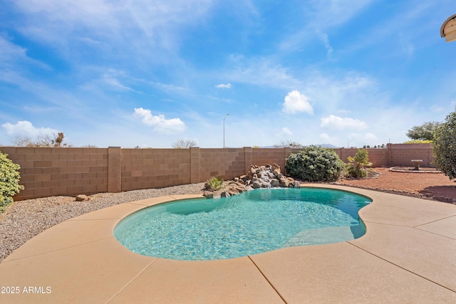 view of swimming pool featuring a patio area, a fenced backyard, and a fenced in pool