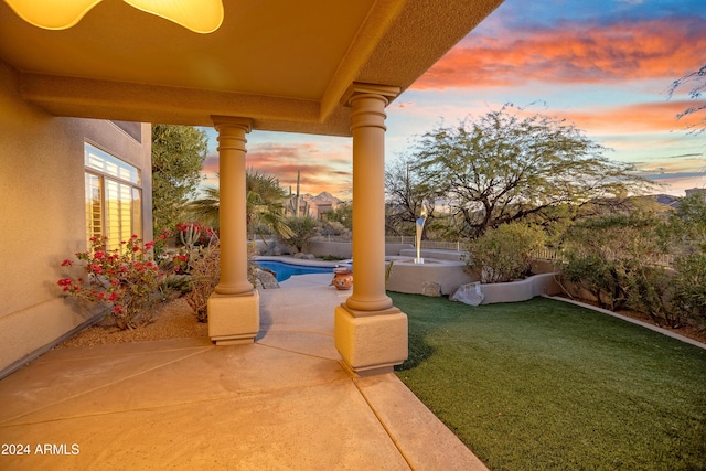 patio terrace at dusk with a lawn