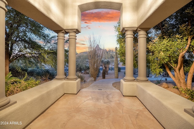 view of patio terrace at dusk