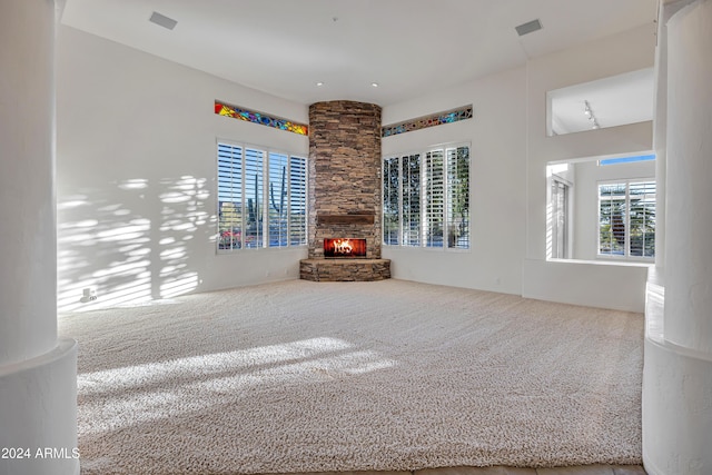 interior space with carpet and a fireplace