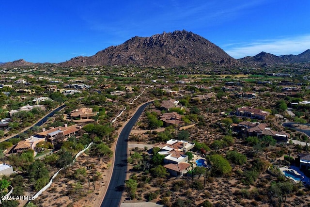 birds eye view of property featuring a mountain view