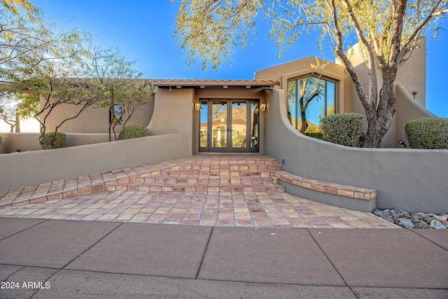 entrance to property featuring french doors