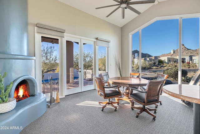 sunroom / solarium with ceiling fan, french doors, and vaulted ceiling