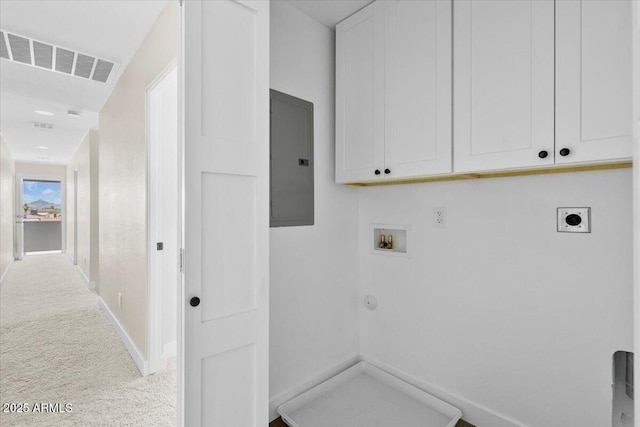 2559 E Broadway Rd, Phoenix, AZ 85040 - laundry area with cabinet space, electric dryer hookup, electric panel, washer hookup, and light carpet