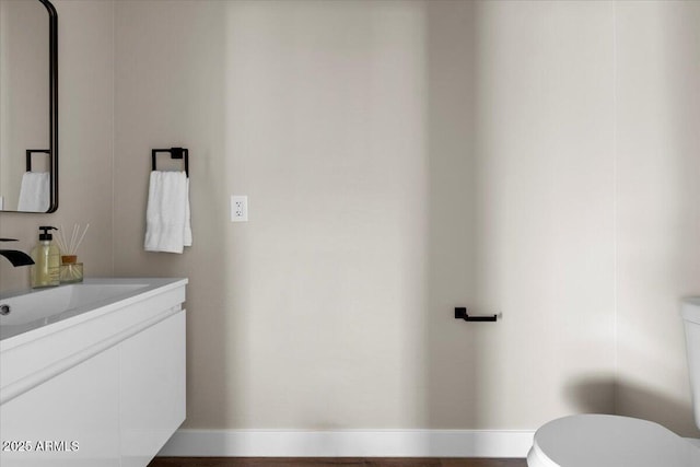 2559 E Broadway Rd, Phoenix, AZ 85040 - half bathroom featuring vanity and toilet