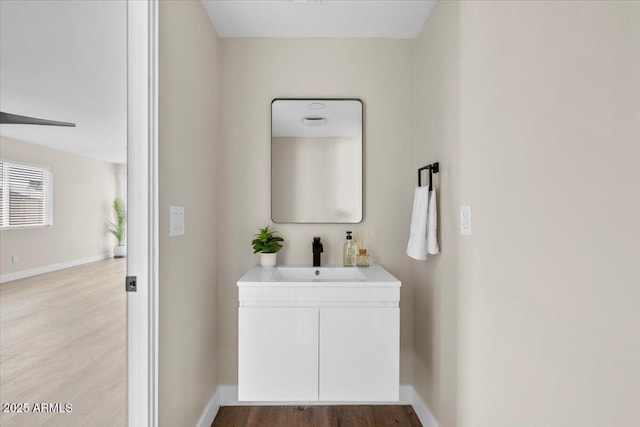 2559 E Broadway Rd, Phoenix, AZ 85040 - bathroom featuring wood finished floors and vanity