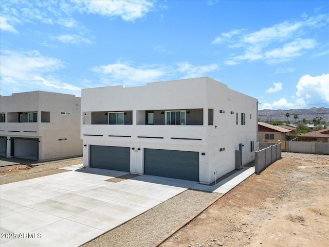 2559 E Broadway Rd, Phoenix, AZ 85040 - view of front of property with an attached garage, driveway, and stucco siding