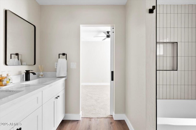 2559 E Broadway Rd, Phoenix, AZ 85040 - bathroom featuring vanity, wood finished floors, a tub, and ceiling fan