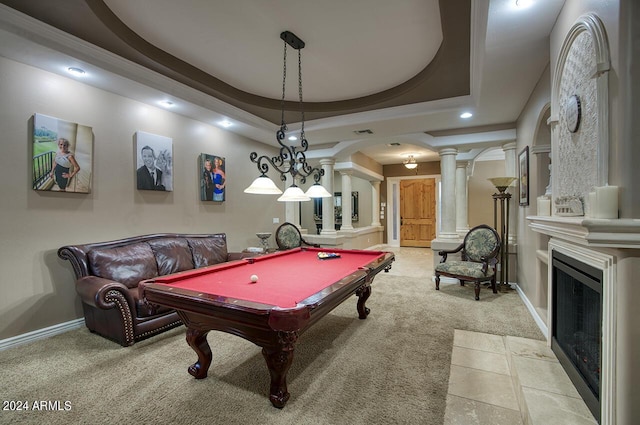 game room with decorative columns, light carpet, pool table, and a tray ceiling