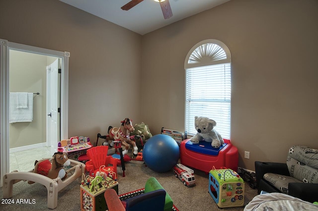 game room with carpet floors and ceiling fan