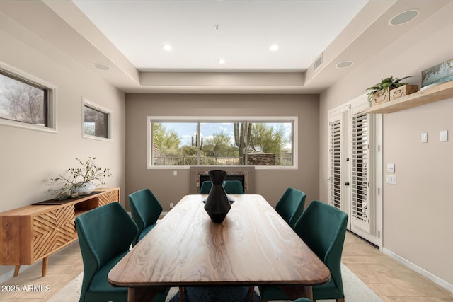 dining area featuring stone tile flooring, visible vents, recessed lighting, and baseboards
