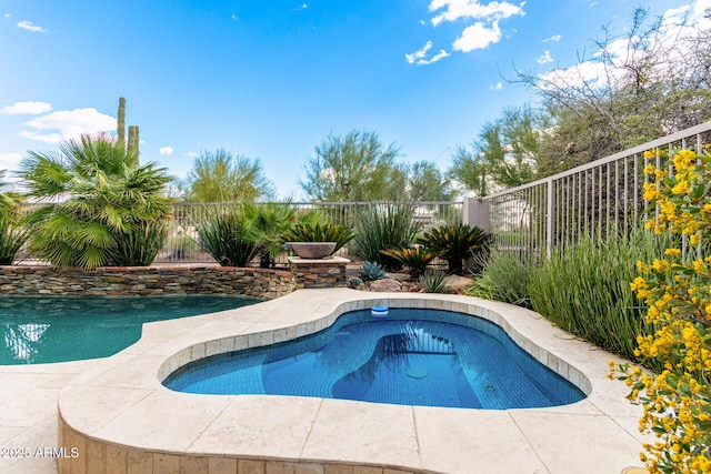 view of swimming pool featuring a fenced in pool and fence