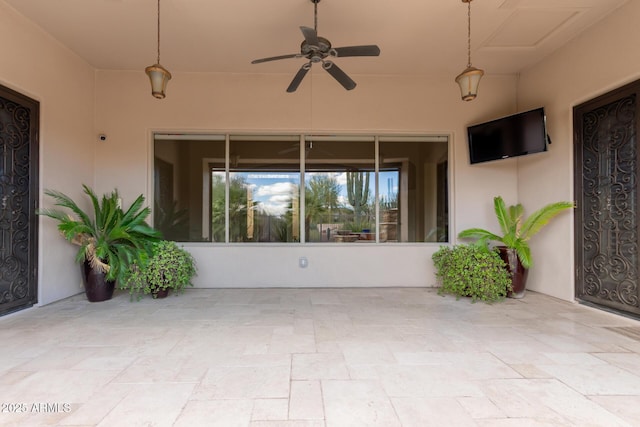 view of patio / terrace featuring ceiling fan
