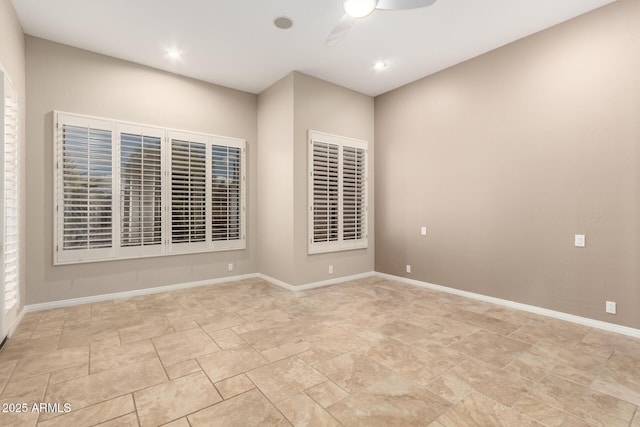 spare room with recessed lighting, a ceiling fan, and baseboards