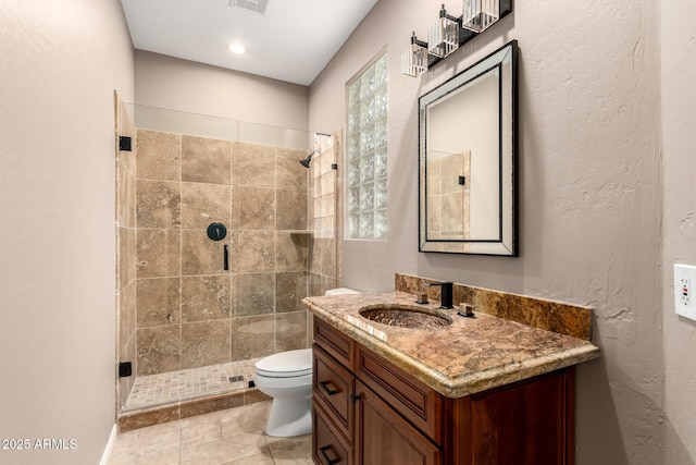 full bathroom featuring visible vents, vanity, toilet, and a shower stall