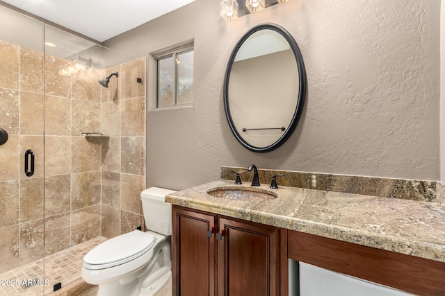 full bath with toilet, a shower stall, and a textured wall