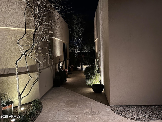 view of side of home featuring stucco siding
