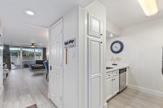 hallway with light hardwood / wood-style floors