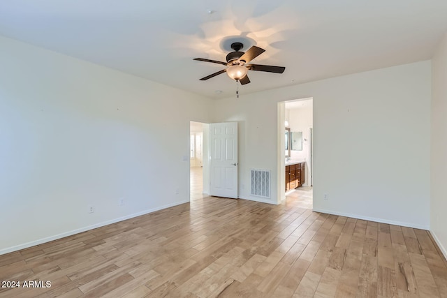 unfurnished room featuring ceiling fan and light wood-type flooring